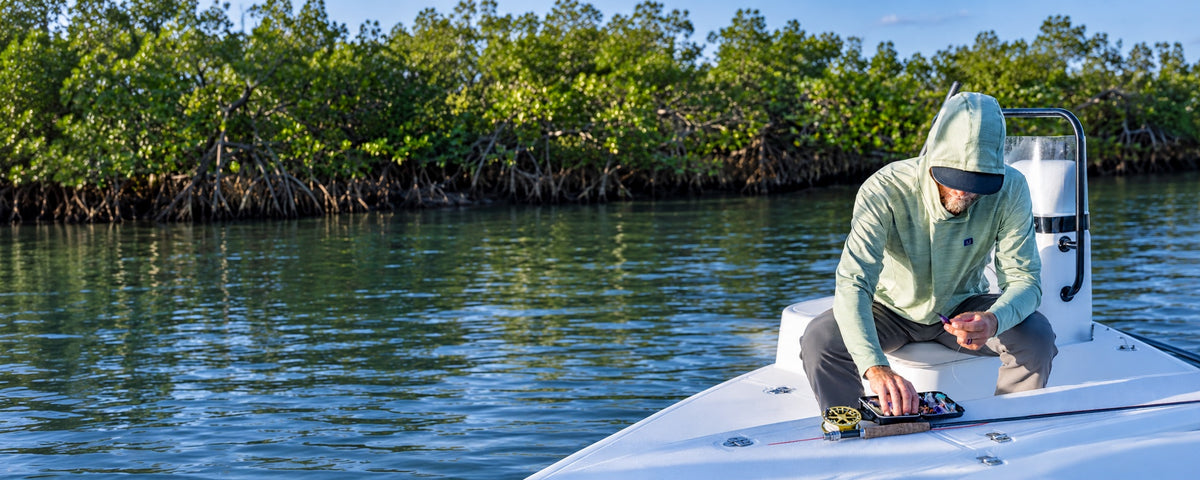 Jesse Hardy choosing a saltwater fly from his fly box