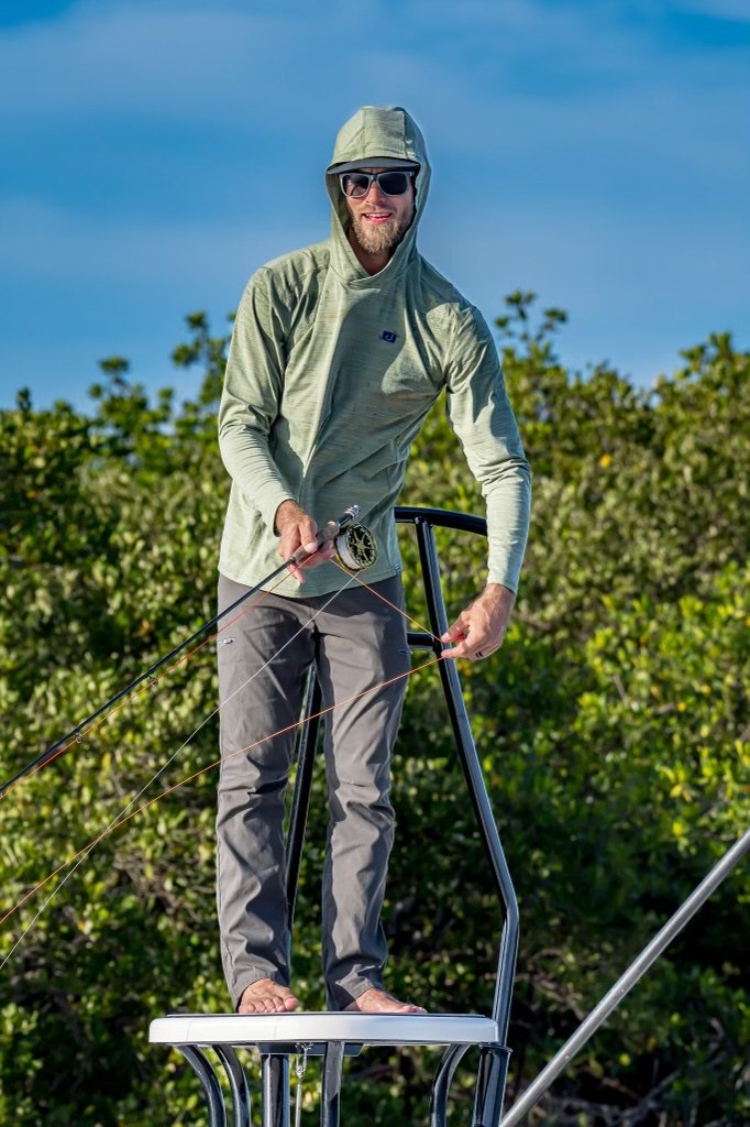 Jesse Hardy on a skiff near the mangroves